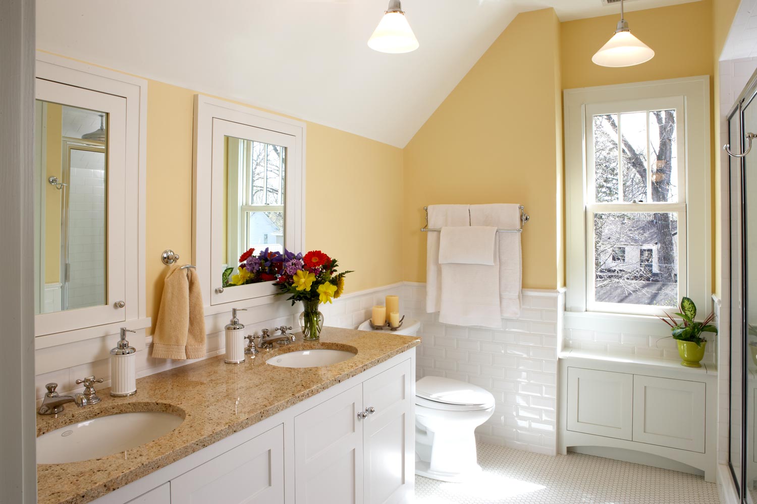 bathroom yellow walls white subway and hex tile
